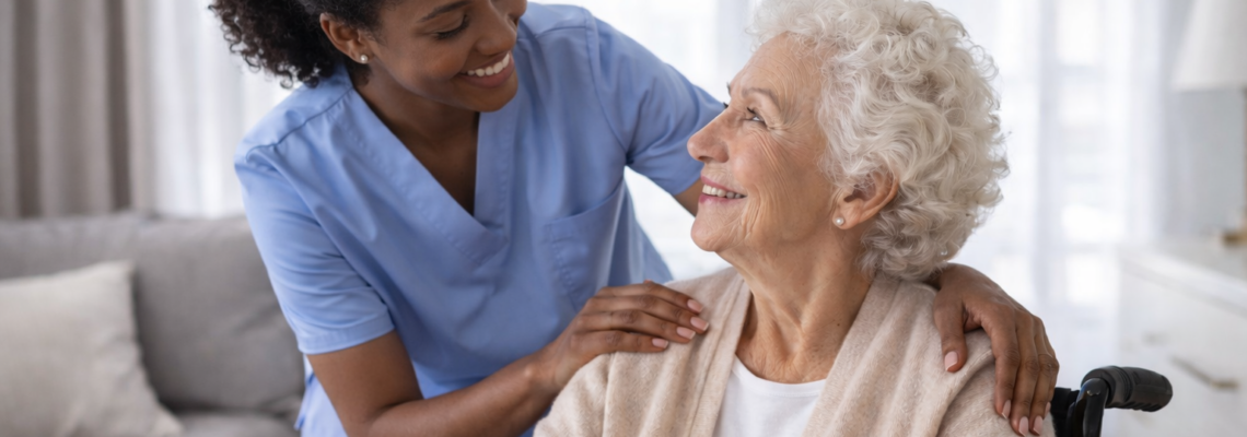 Exhausted family caregiver sitting with hands covering face, representing burnout and compassion fatigue symptoms