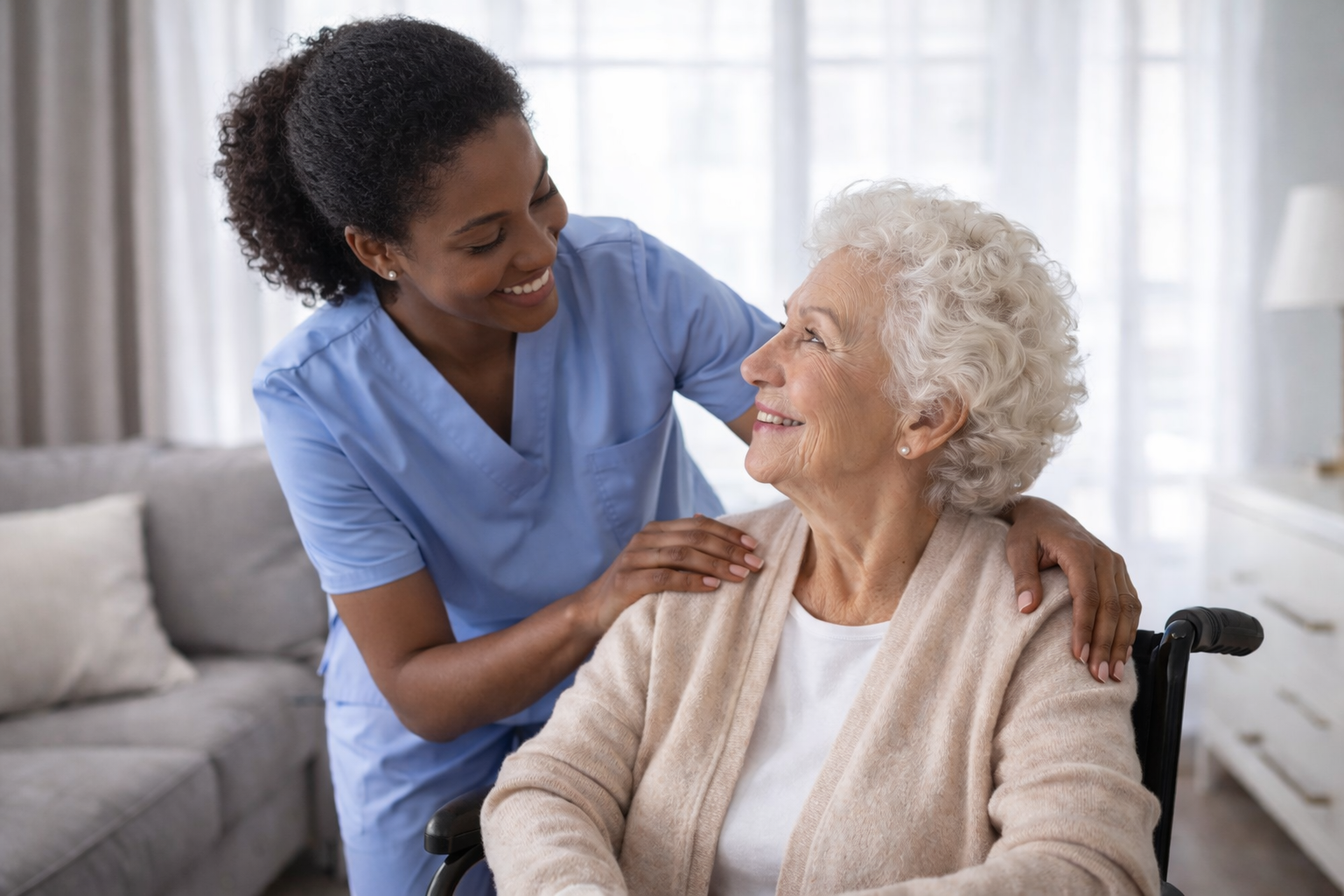 Exhausted family caregiver sitting with hands covering face, representing burnout and compassion fatigue symptoms